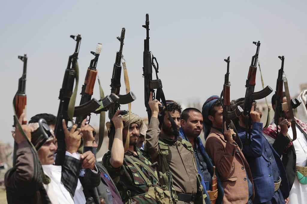 In this Saturday, Aug. 22, 2020 file photo, tribesmen loyal to Houthi militants raise their weapons during a gathering against the agreement to establish diplomatic relations between Israel and the United Arab Emirates in Sanaa, Yemen. (AP)