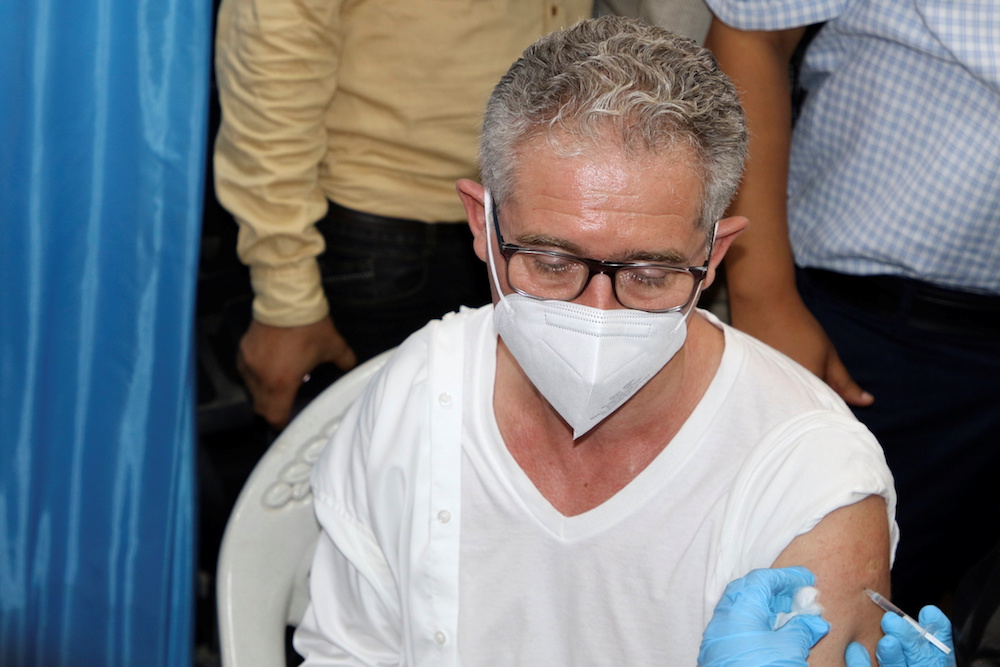 Philippe Duamelle, UNICEF’s representative in Yemen, receives the AstraZeneca COVID-19 vaccine at a medical center in Aden, Yemen April 20, 2021. (Reuters) Philippe Duamelle, UNICEF’s representative in Yemen, receives the AstraZeneca COVID-19 vaccine at a medical center in Aden, Yemen April 20, 2021. (Reuters)