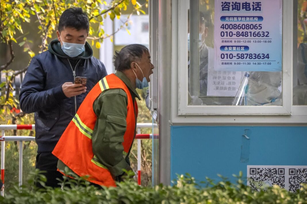 China warns against extra 'layers' of COVID-19 curbs as outbreaks widen